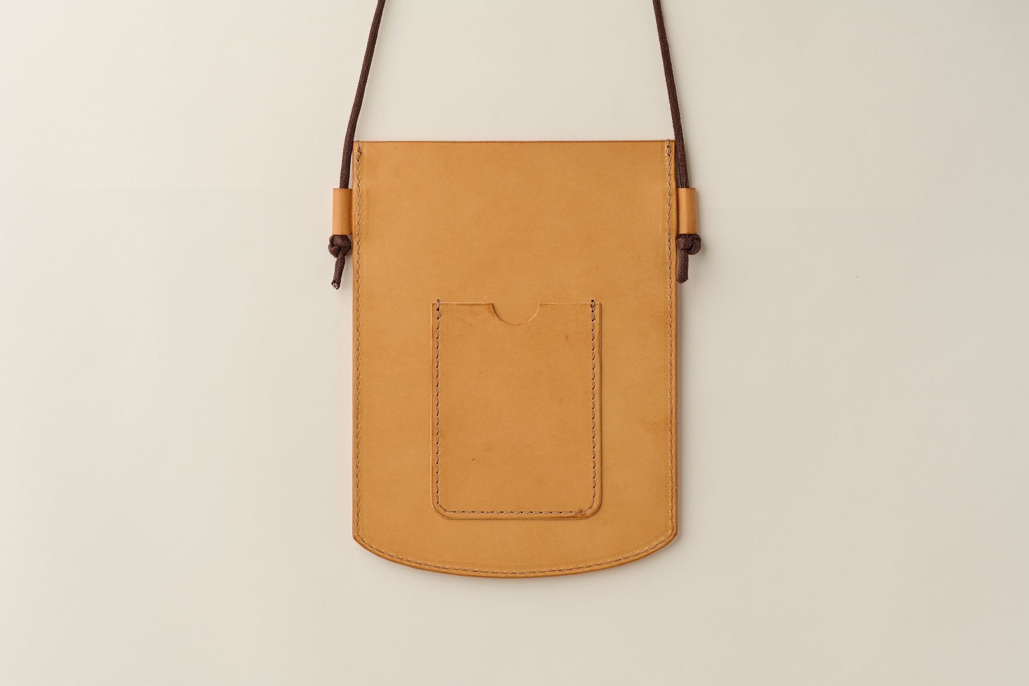 Anya Roux crossbody sleeve natural vachetta.