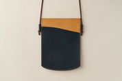 Anya Roux blue and natural vachetta Laverna crossbody pouch.