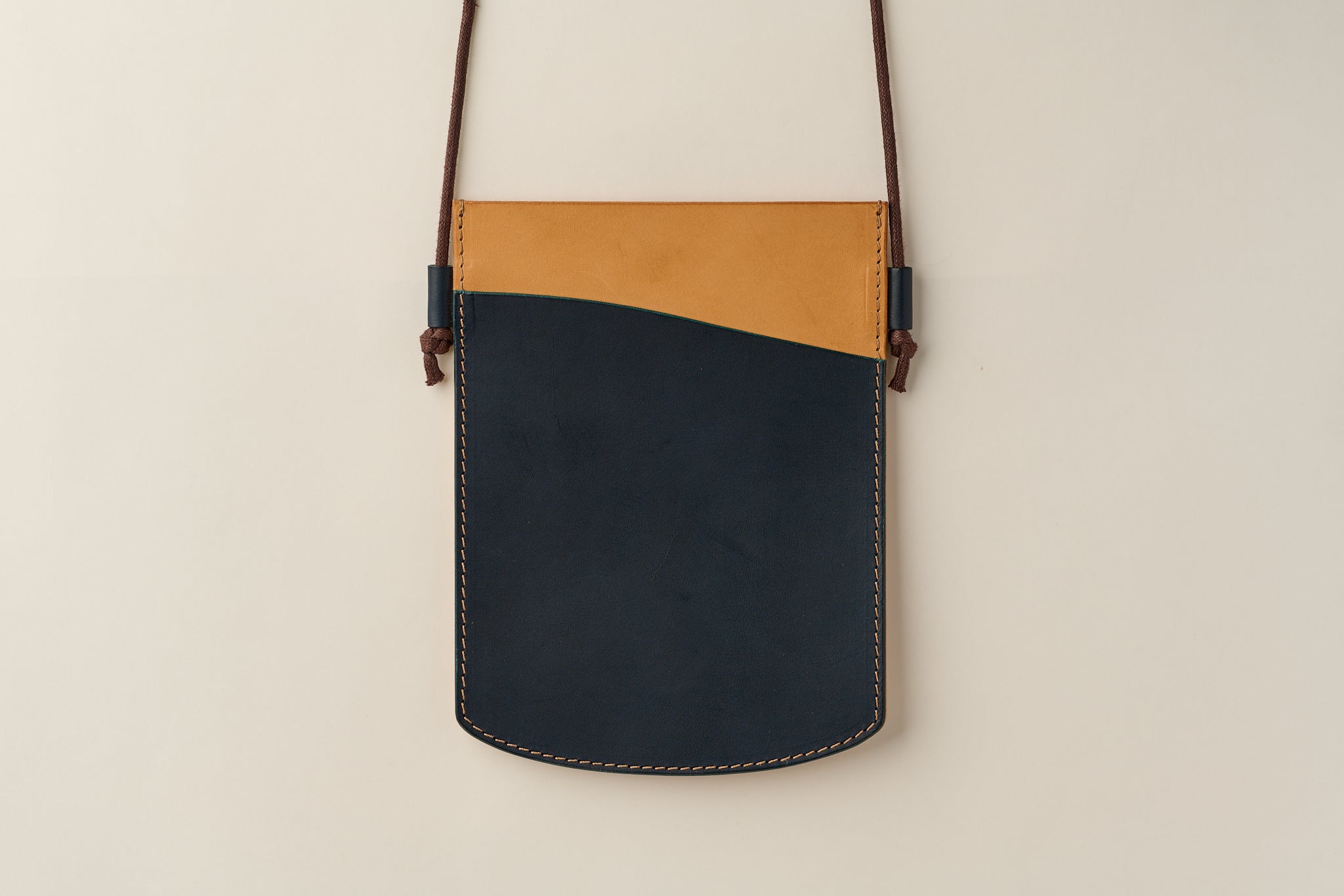 Anya Roux blue and natural vachetta Laverna crossbody pouch.