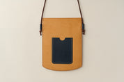 Anya Roux crossbody sleeve vachetta leather.