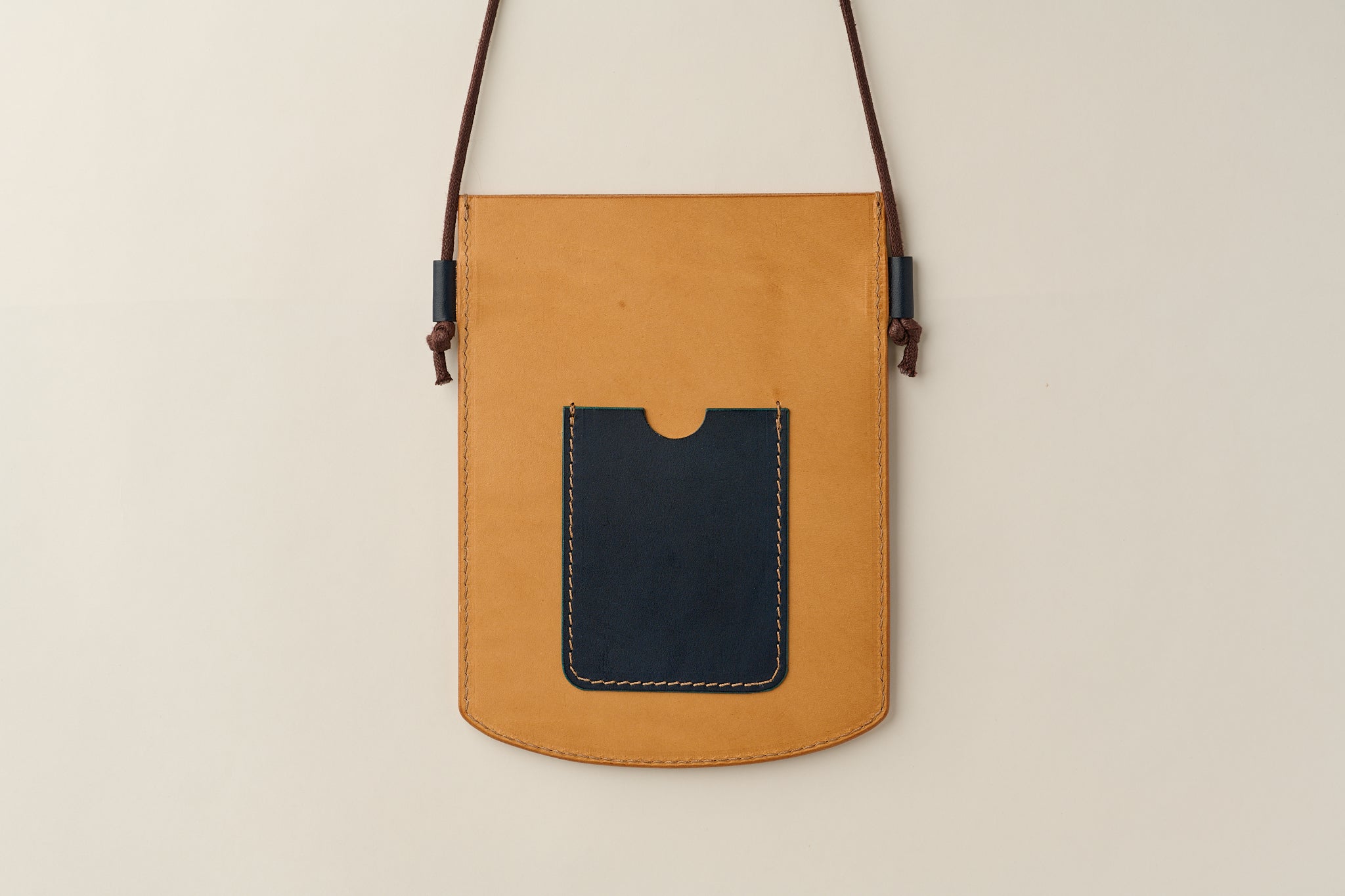 Anya Roux crossbody sleeve vachetta leather.