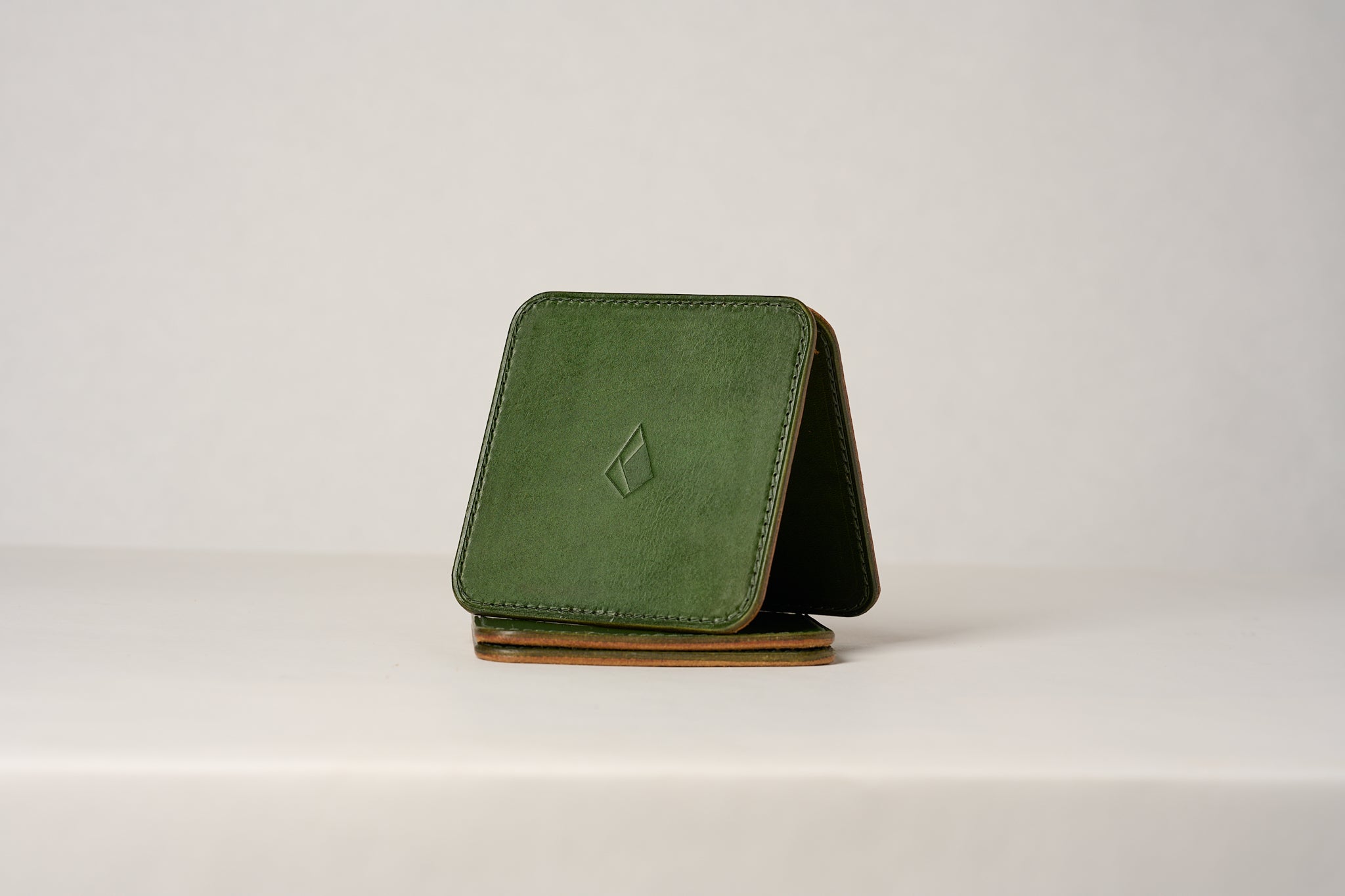 Servi leather coaster set Emerald - Anya Roux