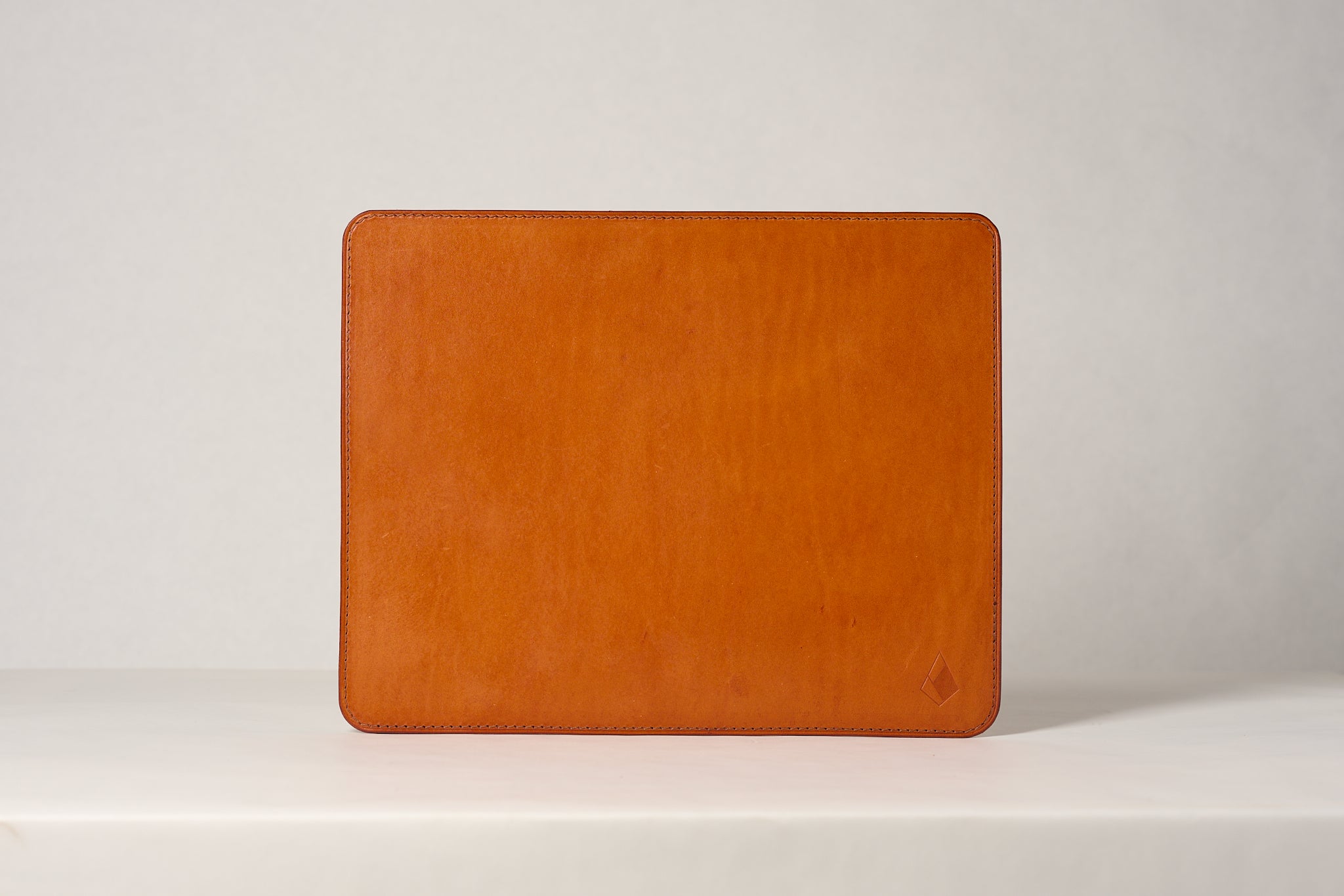 Admiral large leather mouse pad in Olmo leather. Made my Anya Roux.