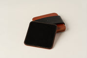 Black suede underside of coaster shown.